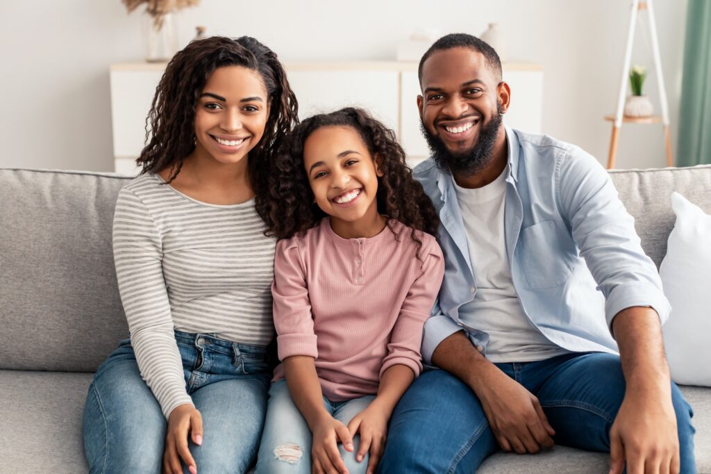 Portrait of a happy black family smiling at home